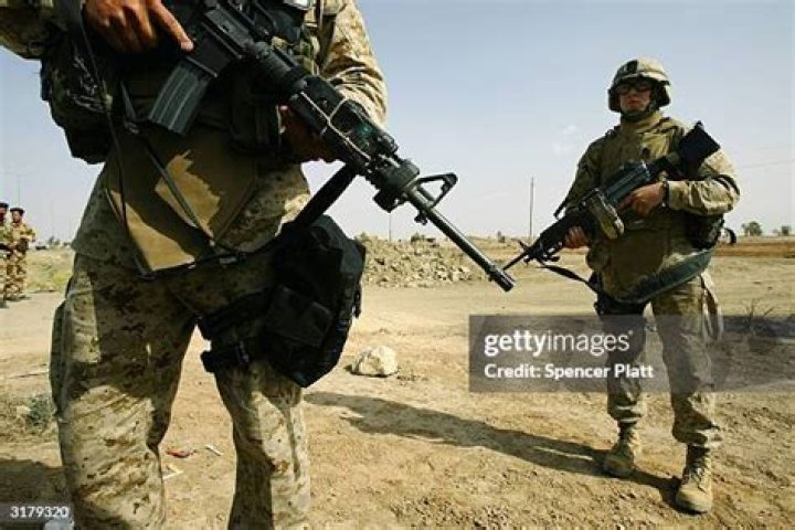 Can civilian contractors carry weapons in Afghanistan?