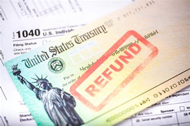 Why does my tax refund go down when I enter spouse income?